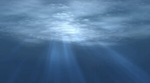 Image of light shining through an ocean